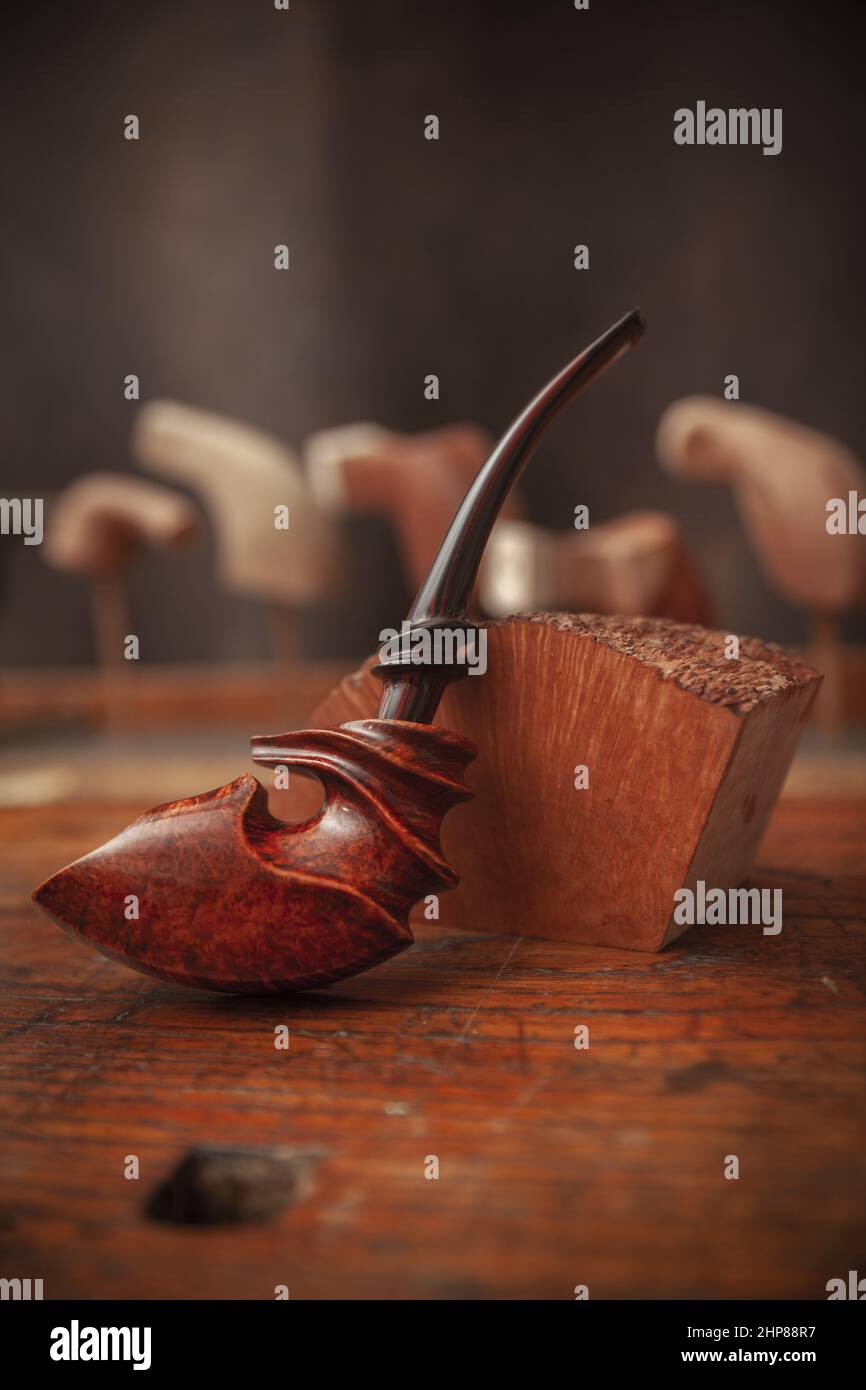 vintage smoking pipe on the leather background, close up Stock Photo