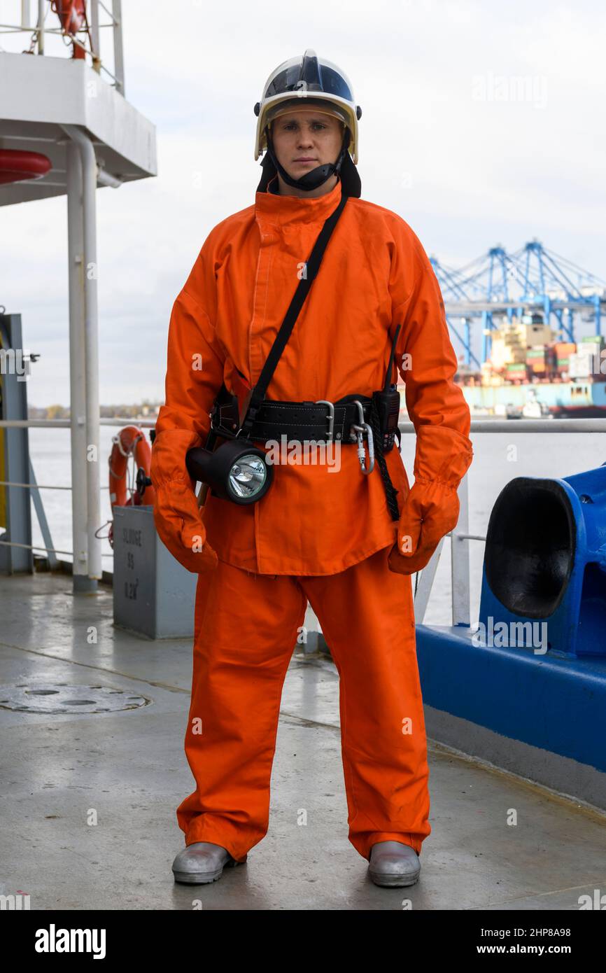 Fireman. Fire fighting equipment. Fire drill. Seaman with firefighter