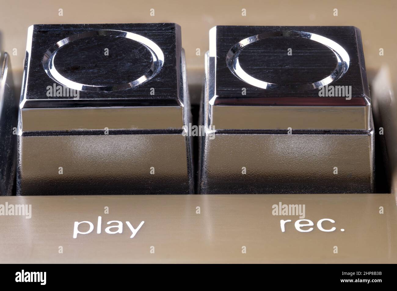 Play and record buttons of an old cassette tape recorder macro Stock Photo