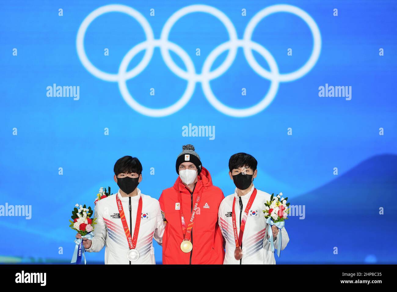 Beijing, China. 19th Feb, 2022. Gold medalist Bart Swings (C) of Belgium, silver medalist Chung Jae Won (L) of South Korea and bronze medalist Lee Seung Hoon of South Korea pose during the awarding ceremony of speed skating men's mass start at the Beijing Medals Plaza of the Winter Olympics in Beijing, capital of China, Feb. 19, 2022. Credit: Xue Yuge/Xinhua/Alamy Live News Stock Photo