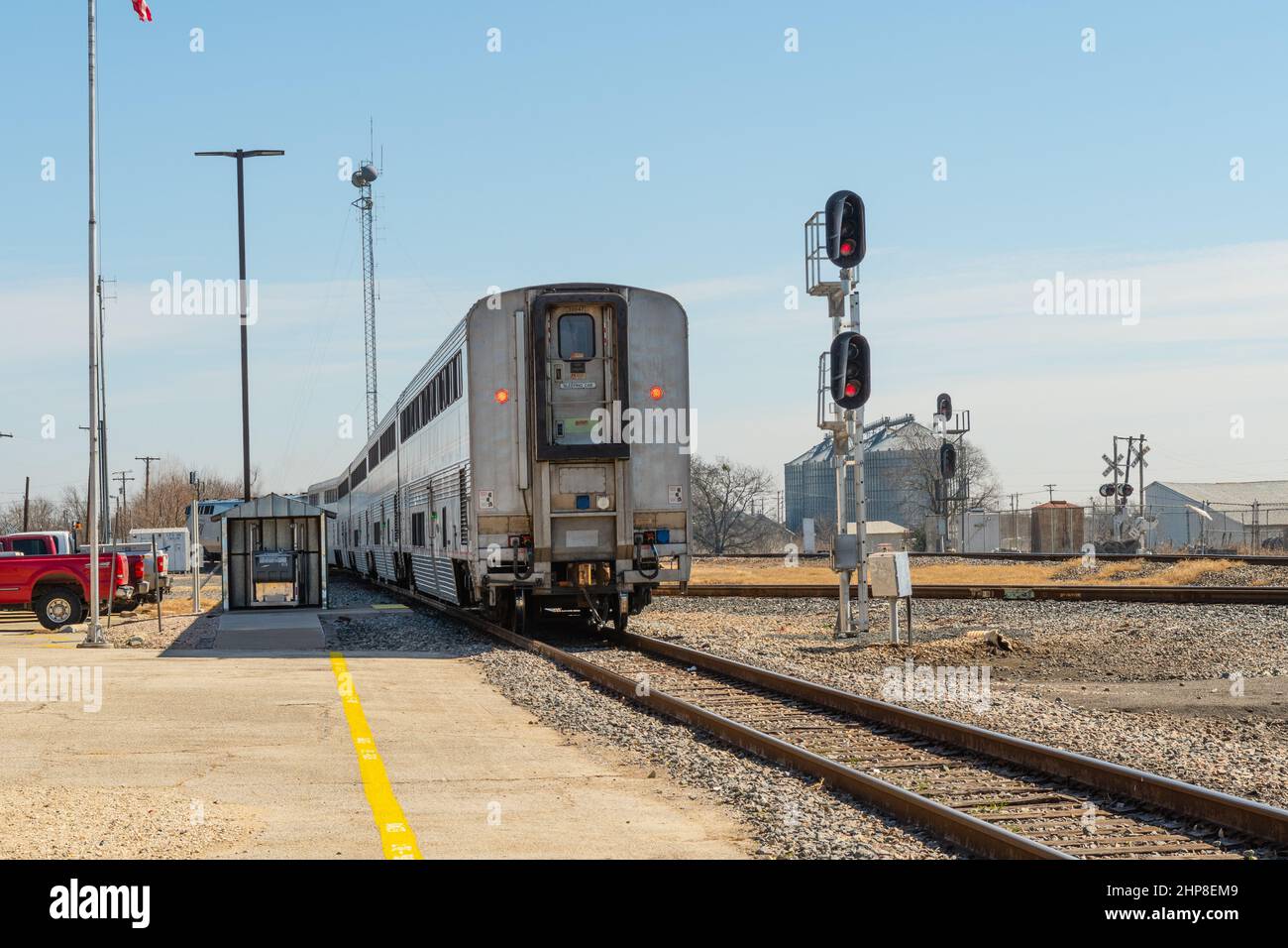 American passenger train Amtrak Texas Eagle passenger coaches departing small Texas passenger station platform Stock Photo