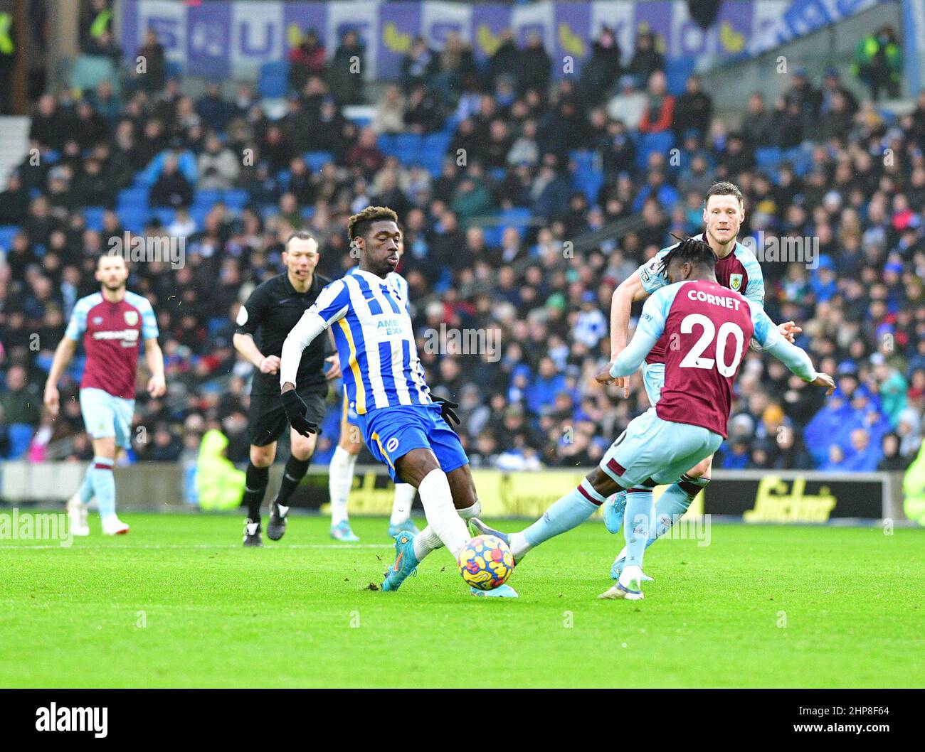 Brighton, UK. 19th Feb, 2022. Maxwell Cornet of Burnley and Yves Bissouma of Brighton and Hove Albion during the Premier League match between Brighton & Hove Albion and Burnley at The Amex on February 19th 2022 in Brighton, England. (Photo by Jeff Mood/phcimages.com) Credit: PHC Images/Alamy Live News Stock Photo