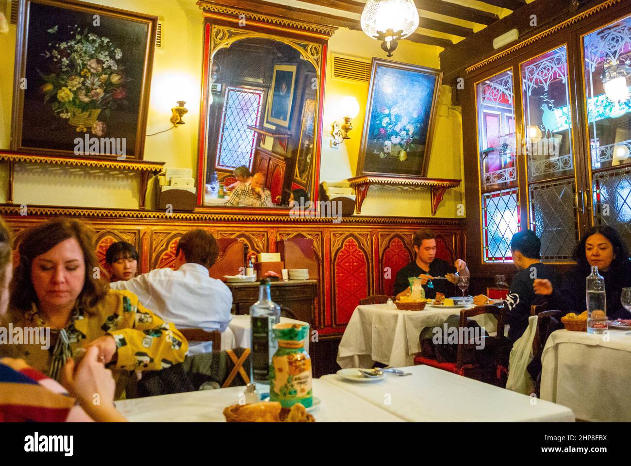 Madrid, Spain, Medium Crowd People inside Sharing Meals, Traditional Spanish Bistro  Tavern Restaurant Vintage interior  design 'Sobrino de Botin » old restaurant interior (oldest restaurant in World, 1725) Stock Photo