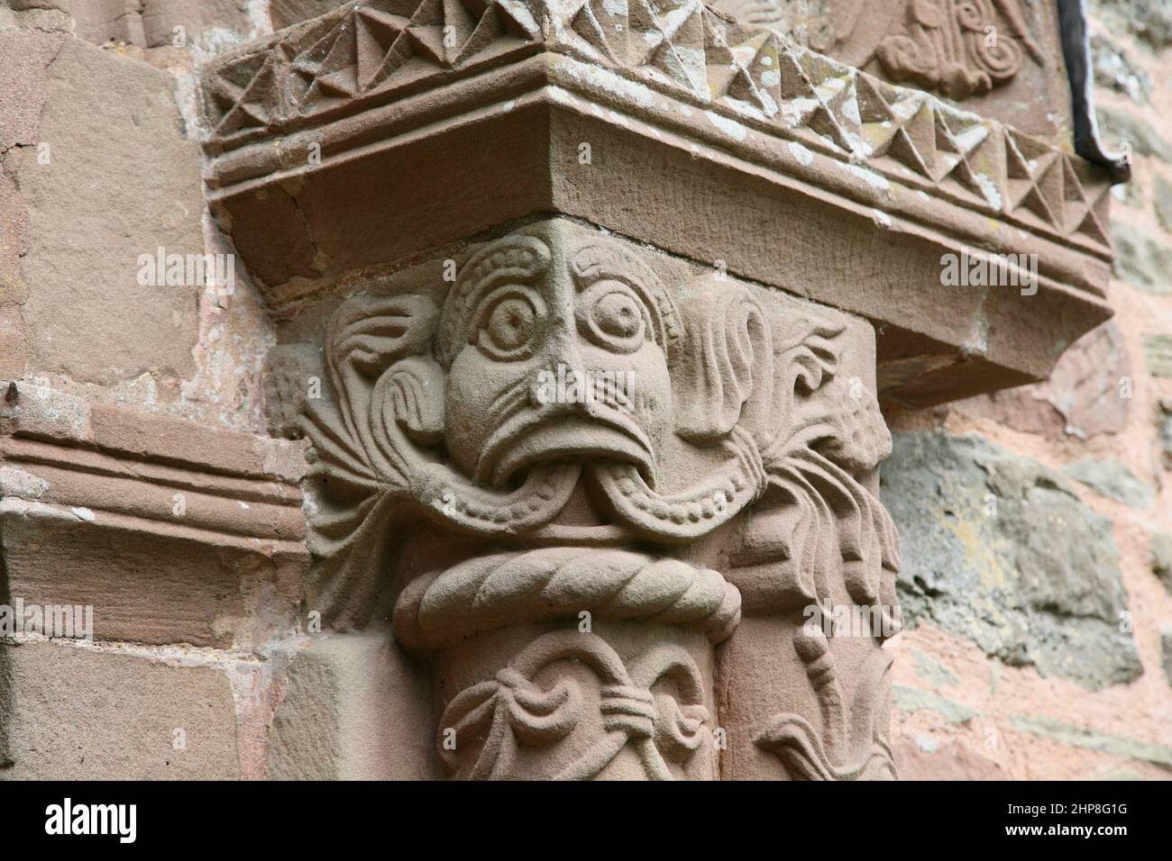 Green Man carving  door pillar Kilpeck Church Stock Photo