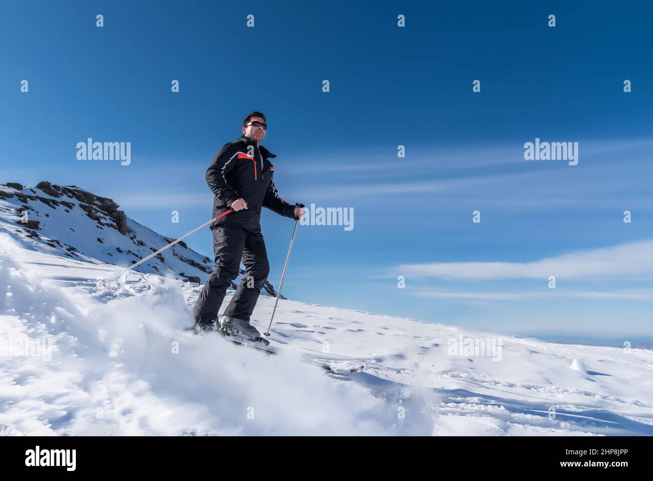 Premium Photo  Skier sliding down the mountain on the snow in the ski  resort