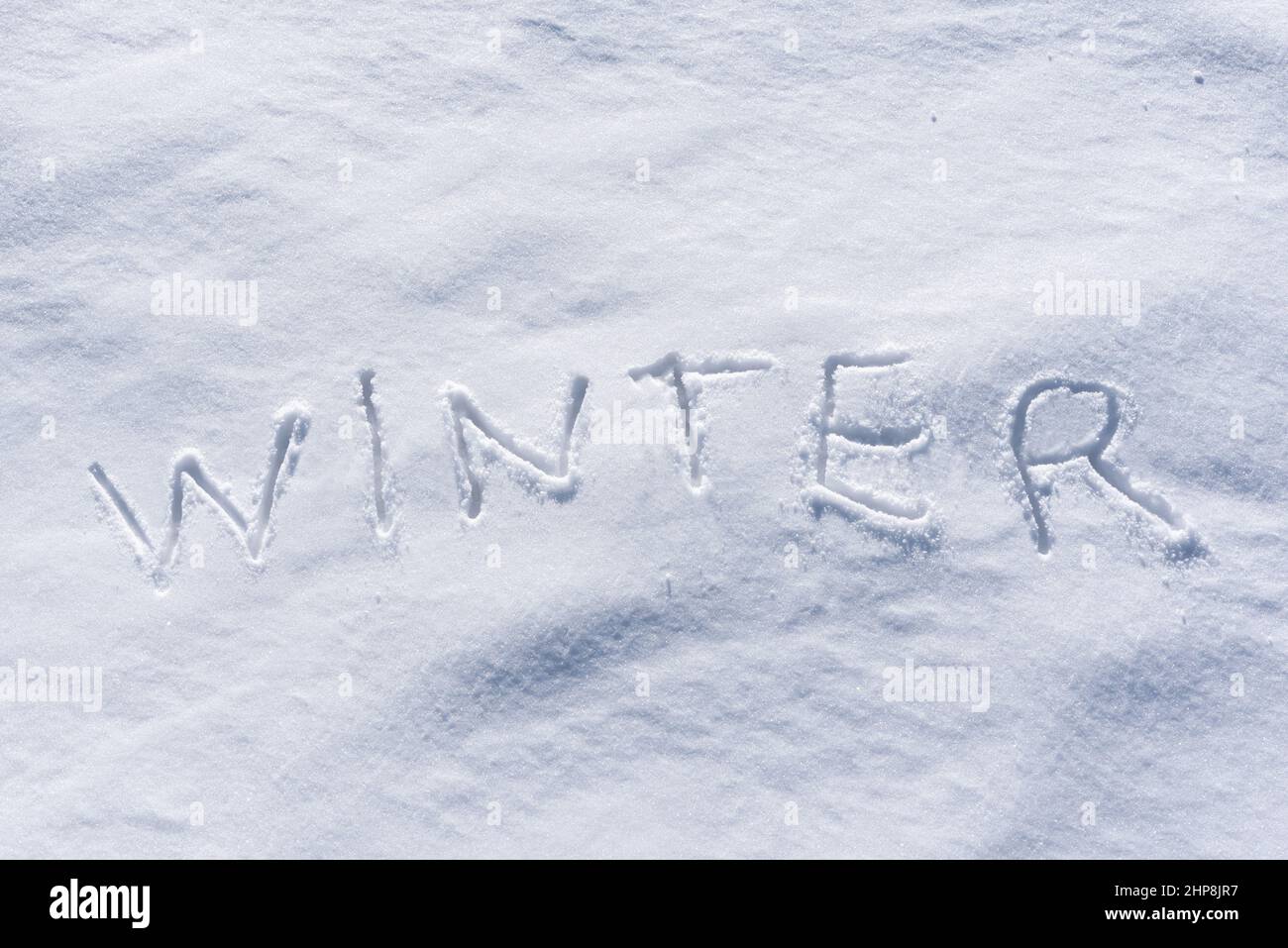 Winter word written in the snow Stock Photo
