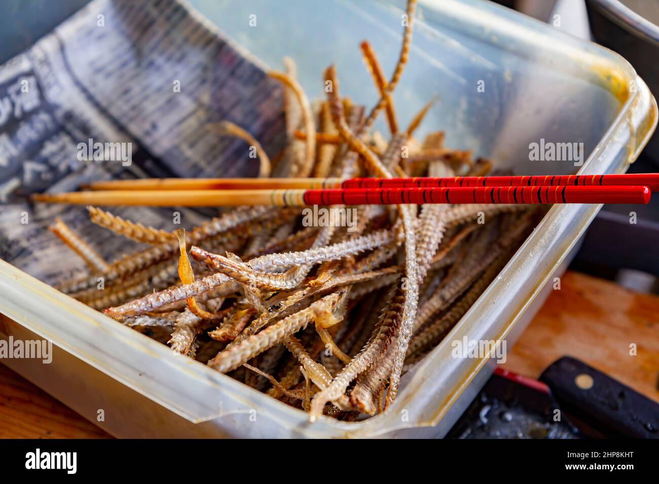 Close up shot of preparation of the delicious fish bone at Japan Stock