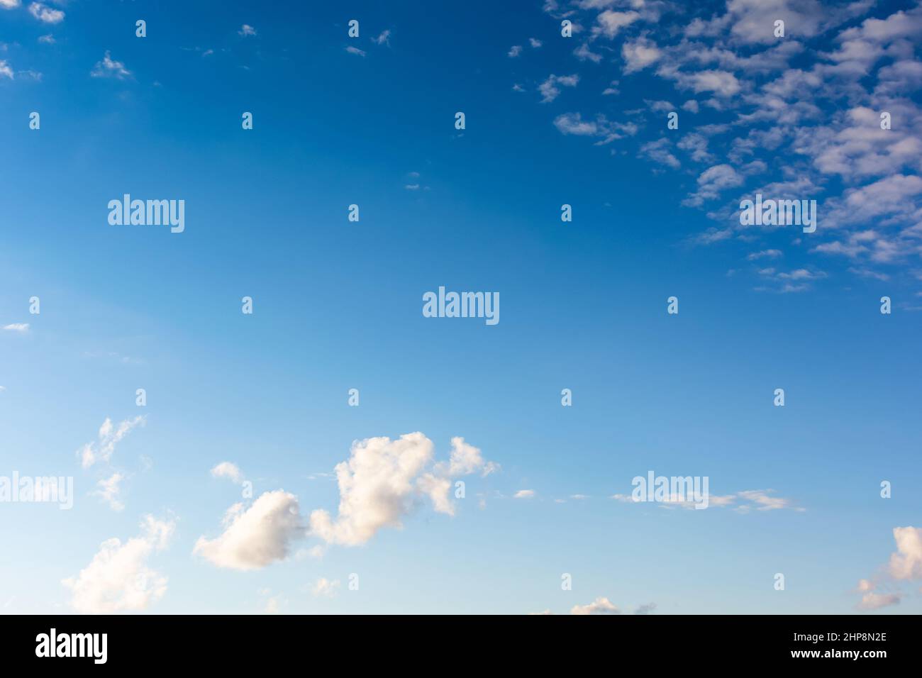 white clouds on the blue sky. sunny weather in the morning. beautiful nature background Stock Photo