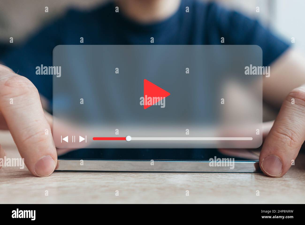 Video player interface concept. The person is using a smartphone Stock Photo