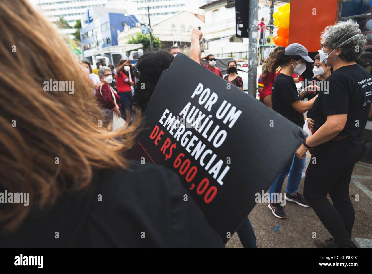 People protest against the government of President Jair Bolsonaro in the city of Salvador. They use banners, Stock Photo