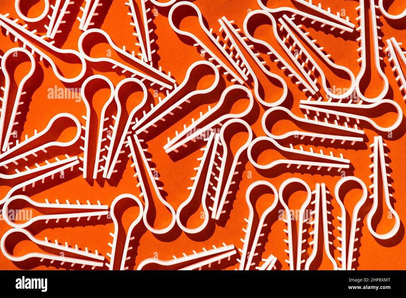 orange, brown background with white details, Texture. surface, area, side. Abstract image. Colored  Background.  White objects on orange, brown backgr Stock Photo