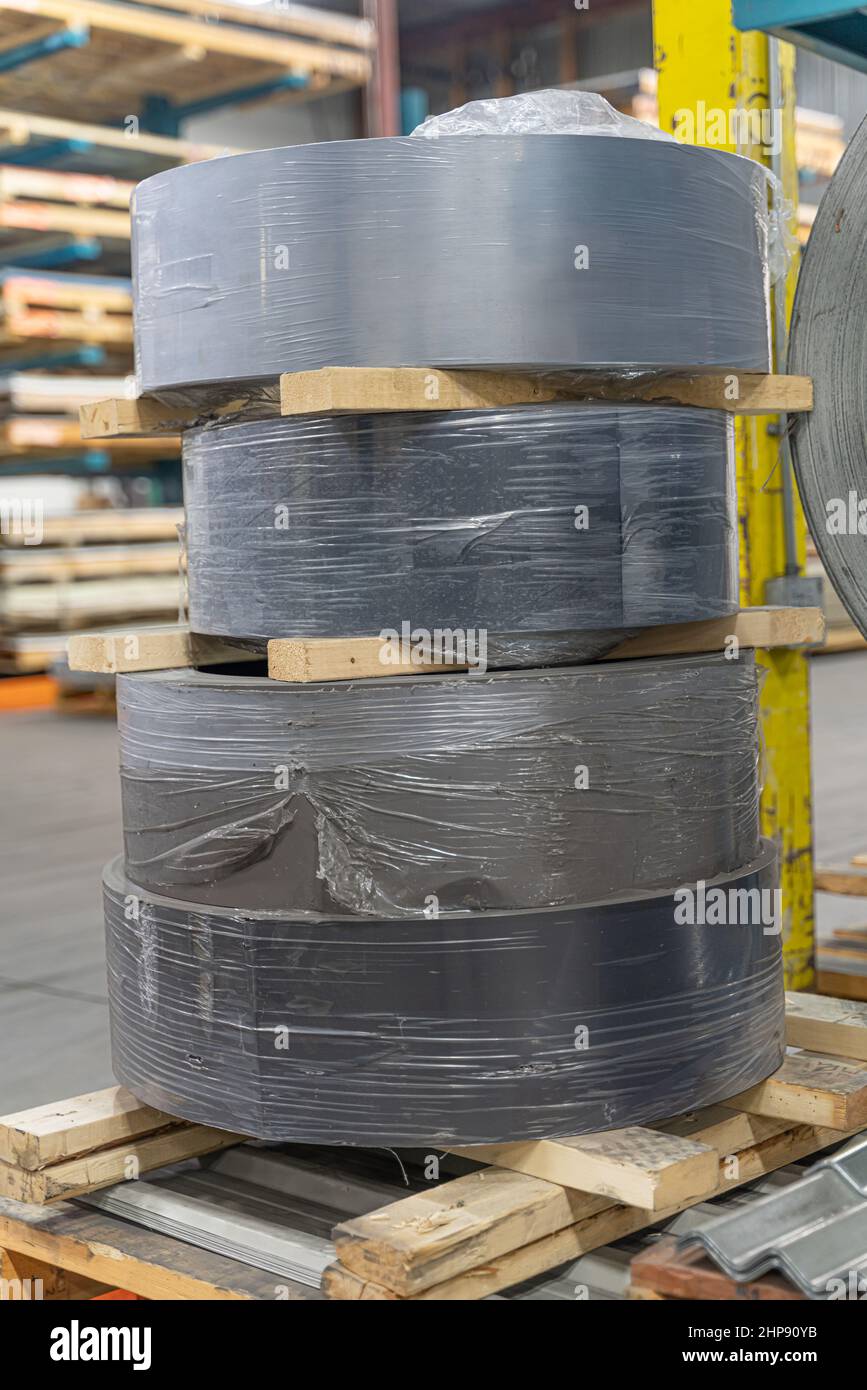 stack of Coil steel metal rolls in metal roofing factory Stock Photo ...
