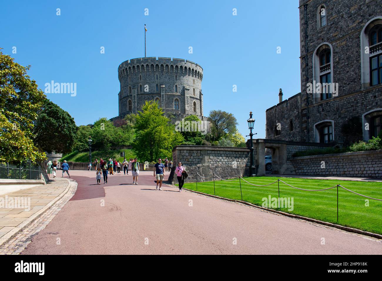 A pathway leads to the Round Tower of Windsor Castle.  A motte and bailey style fortification topped with a keep.  Windsor, Berkshire, England. Stock Photo