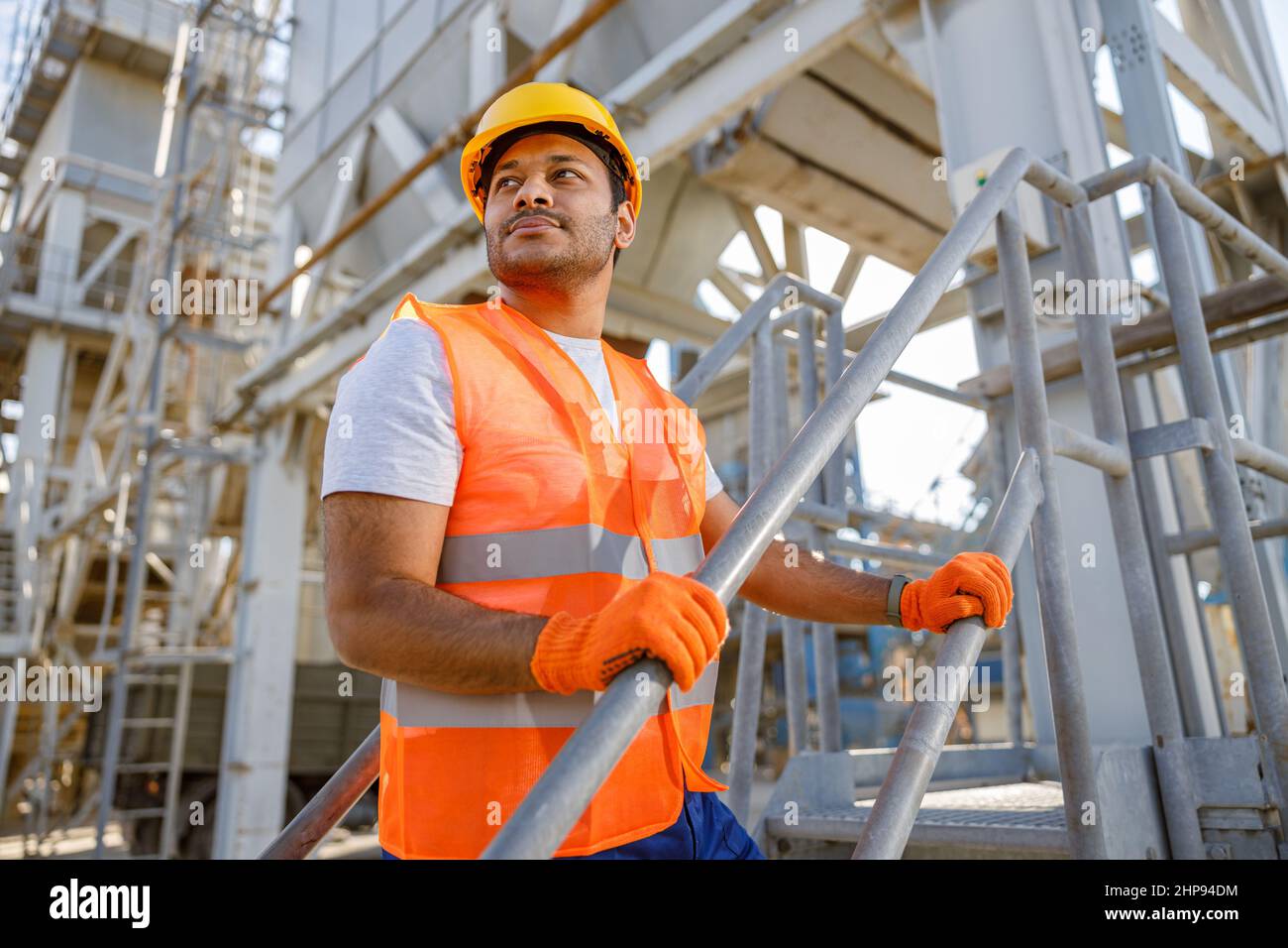 Skillful multiethnic engineer working on construction site Stock Photo