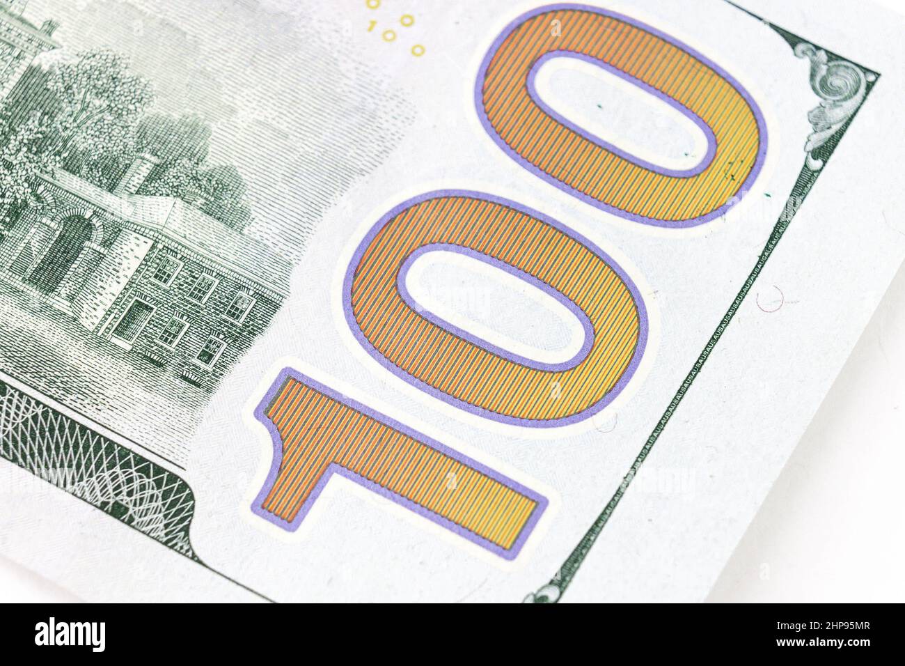 Number 100 on 100 dollar bill, fragment of new 100 dollar, part of United states hundred dollars money bill. Dolar USA close up Stock Photo