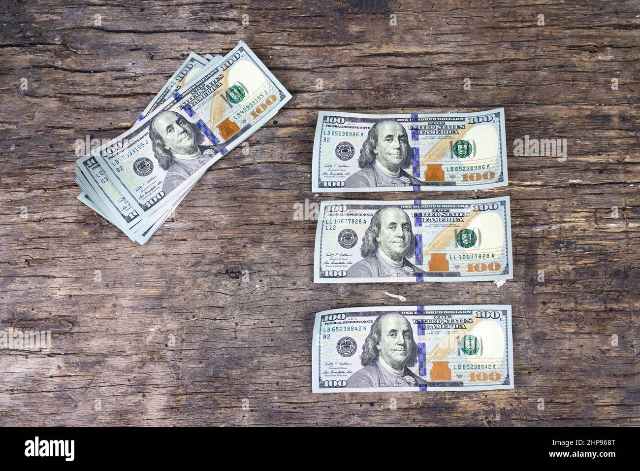 Illegal production of US dollars. United States dollars fake banknotes. One hundred American dollars bills Stock Photo