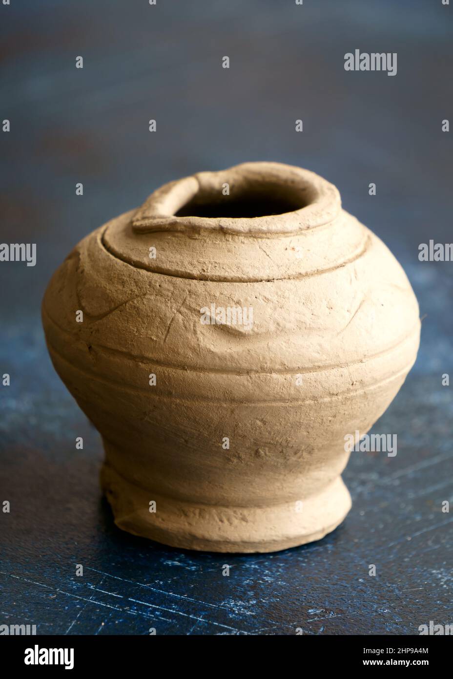 Preparation of a small clay vase.Handmade. Pottery. Stock Photo