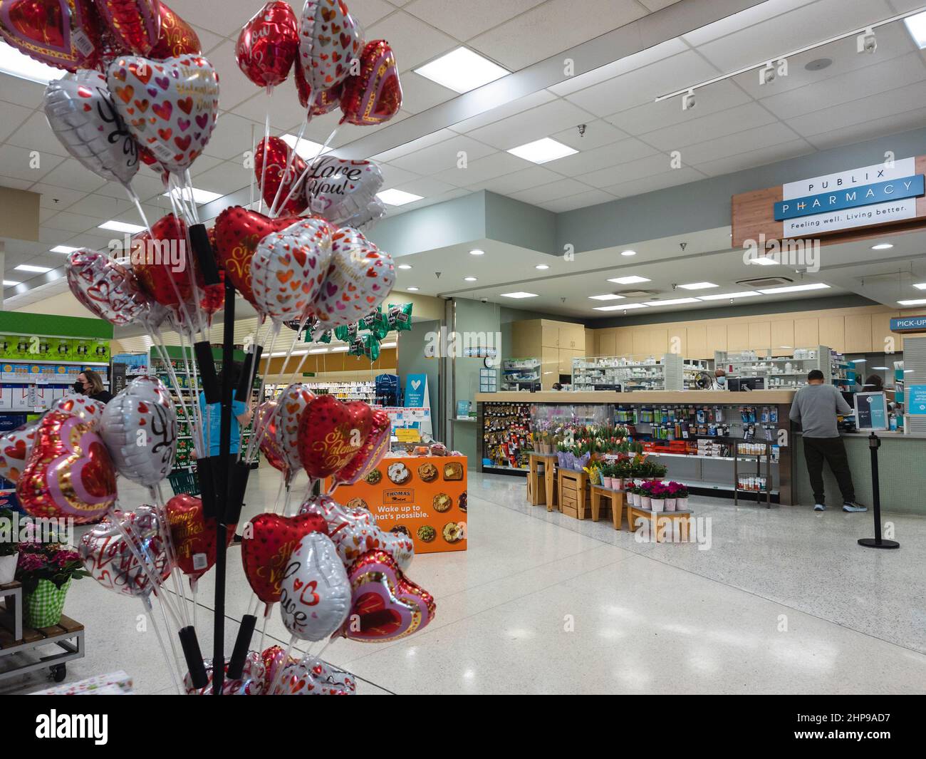 Orlando, Florida - February 8, 2022: Horizontal Indoor View of Publix Pharmacy with Customer Making Payment. Stock Photo