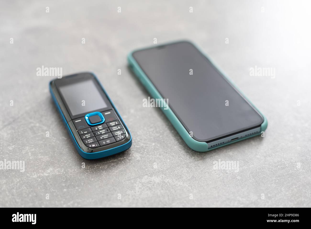 old feature phone with new smartphone Stock Photo