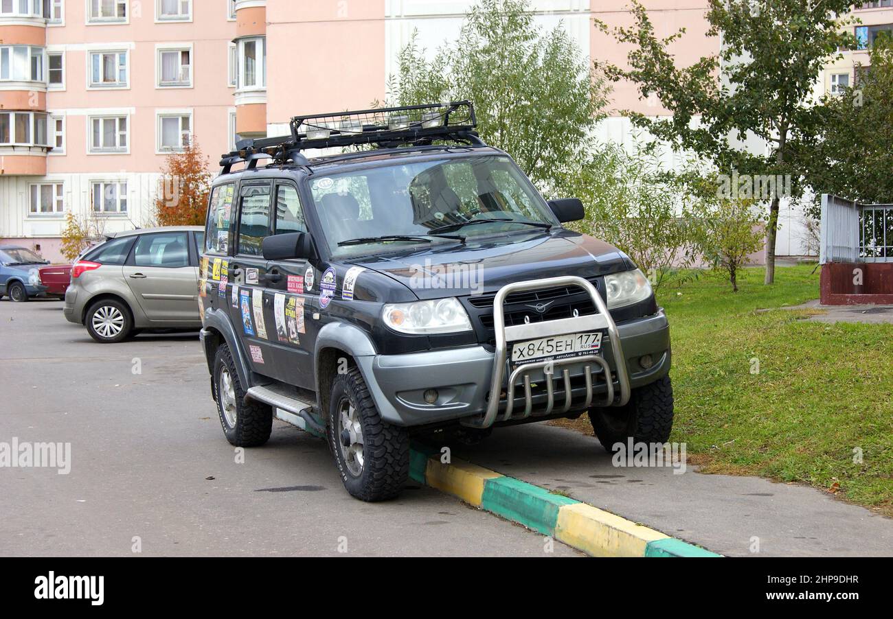 Russian-made SUV UAZ Patriot, parked on a sidewalk in a residential area, Moscow, Russia Stock Photo