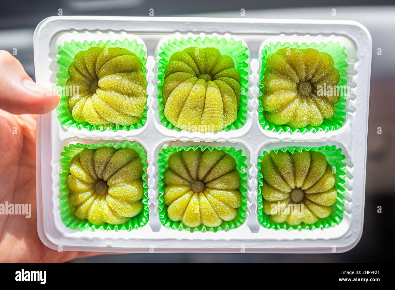 Closeup of storebought product package of green tea matcha or melon filled mochi rice cake