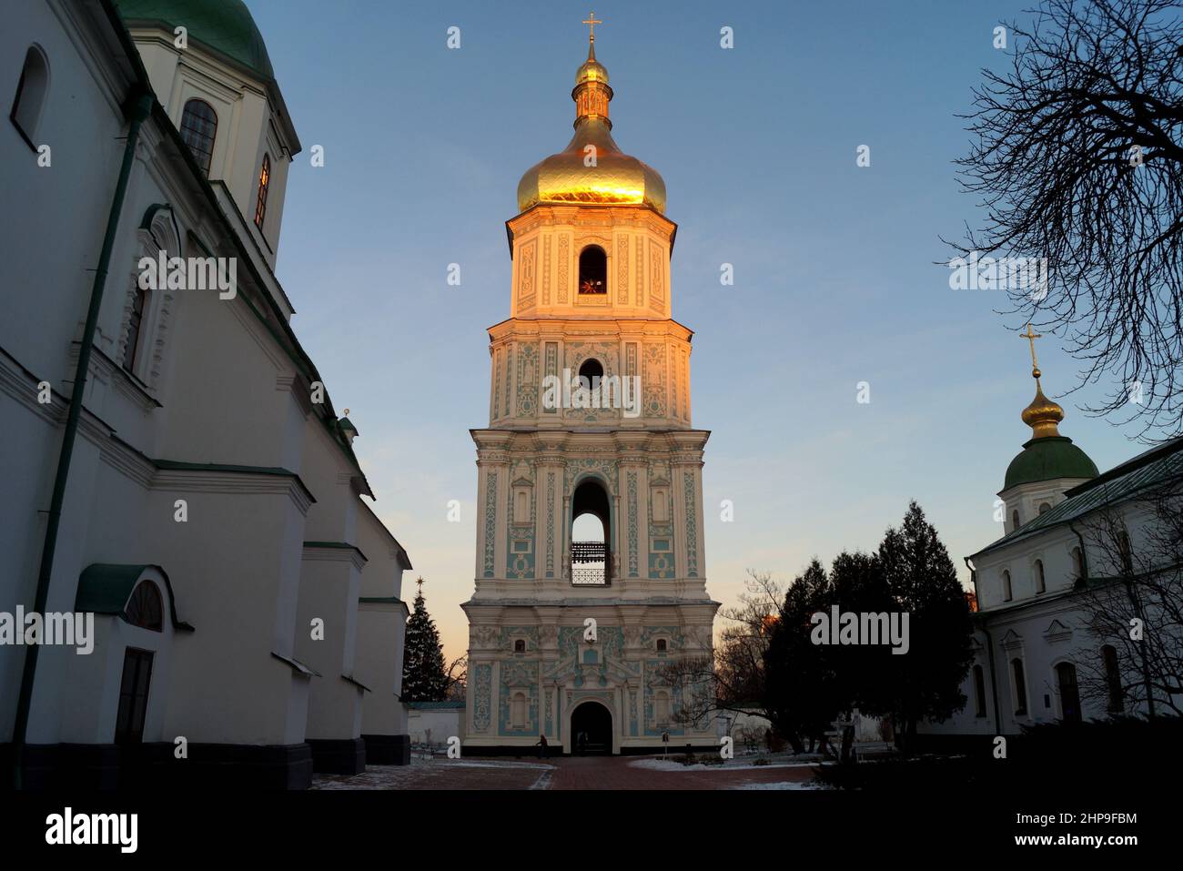 Bell tower of St. Sophia Cathedral, early 18th-century architectural monument of Ukrainian Baroque, inner courtyard side view at sunset, Kyiv, Ukraine Stock Photo