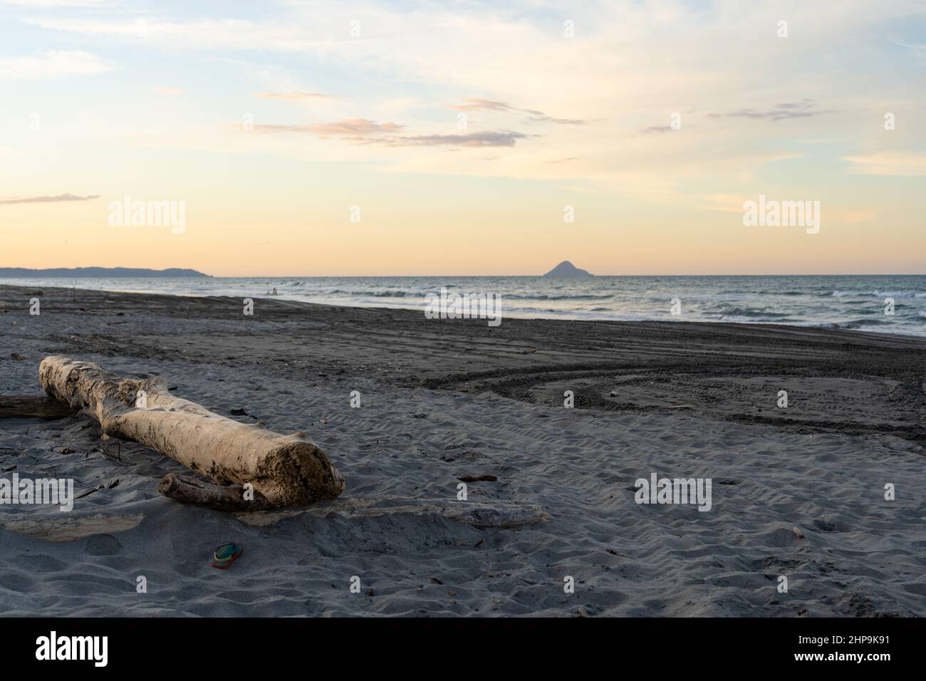 Dusk along a Bay of Plenty beach in New Zealand with Moutohora Island in the background Stock Photo