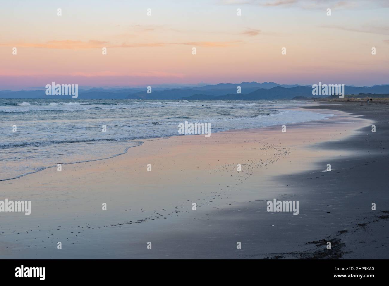 Dusk along a Bay of Plenty beach in New Zealand Stock Photo