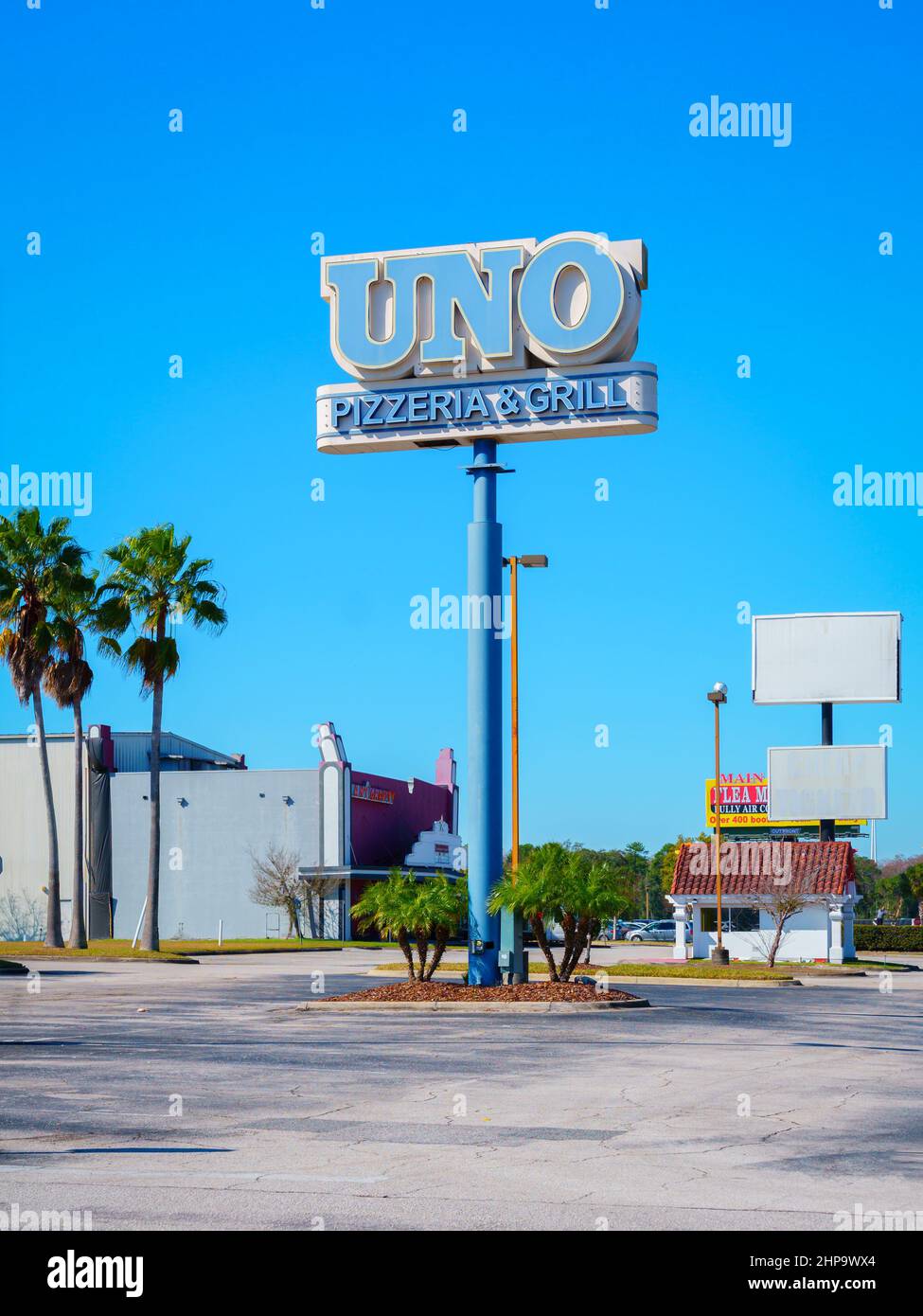 Kissimmee, Florida - February 9, 2022: Vertical Wide View of Uno Pizzeria and Grill Restaurant Sign on a Tall Street Post. Stock Photo