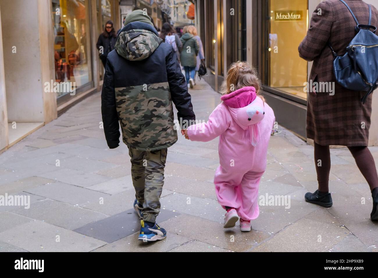 Venice, Italy. 19th Feb, 2022. Masked children stroll the streets of Venice during Venice Carnival 2022, News in Venice, Italy, February 19 2022 Credit: Independent Photo Agency/Alamy Live News Stock Photo