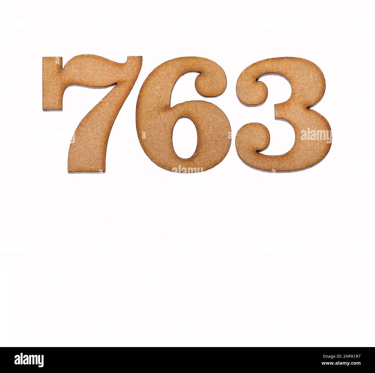 Number 763 in wood, isolated on white background Stock Photo - Alamy