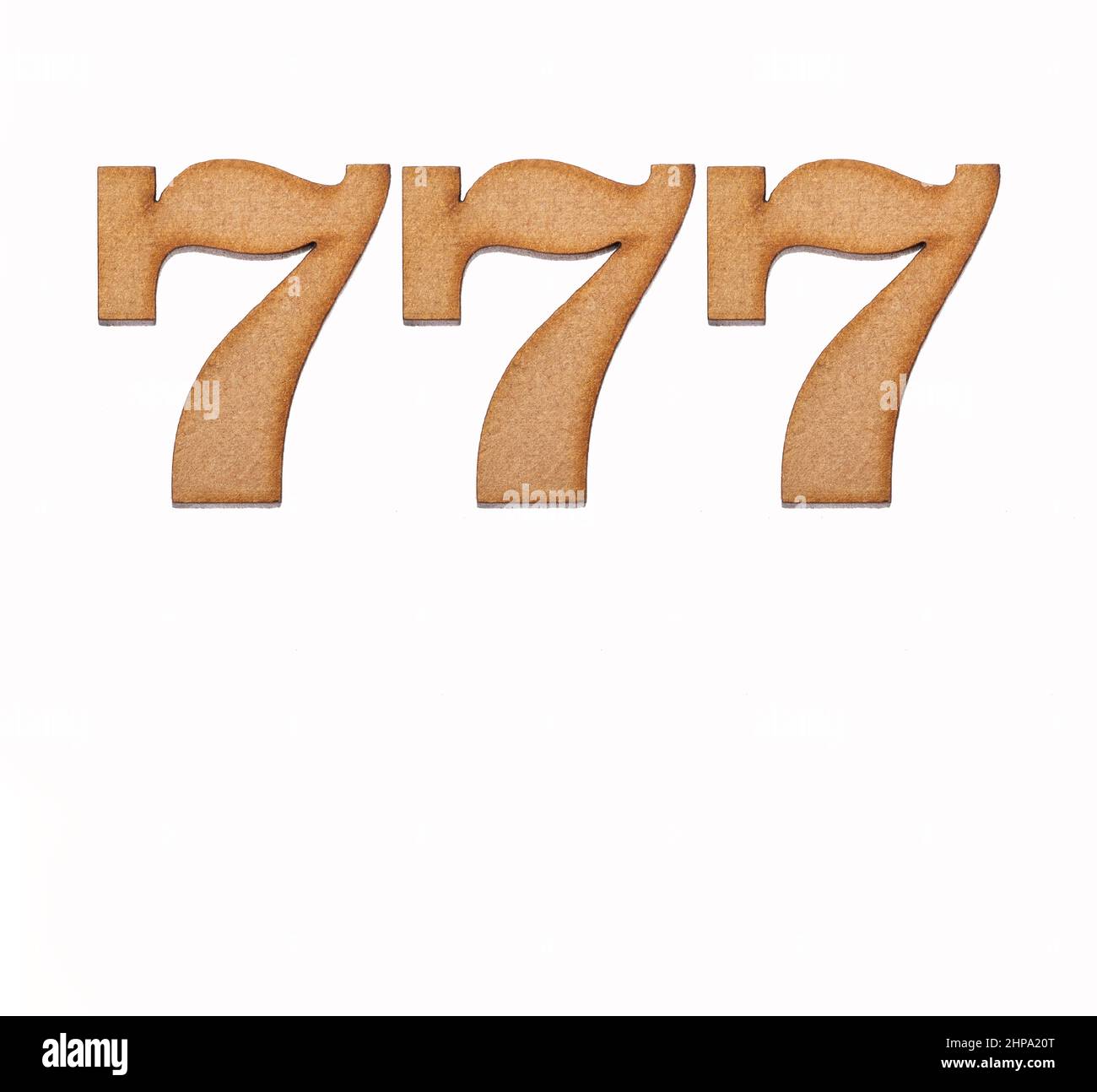 Number 777 in wood, isolated on white background Stock Photo - Alamy