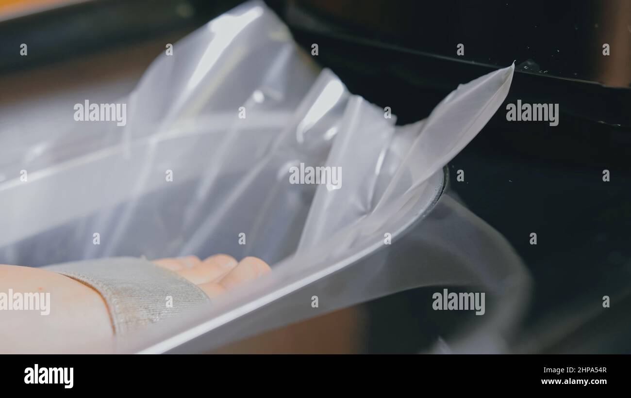 Automatic Thermal Shrinkable Shoe Cover Laminating Machine. Close up