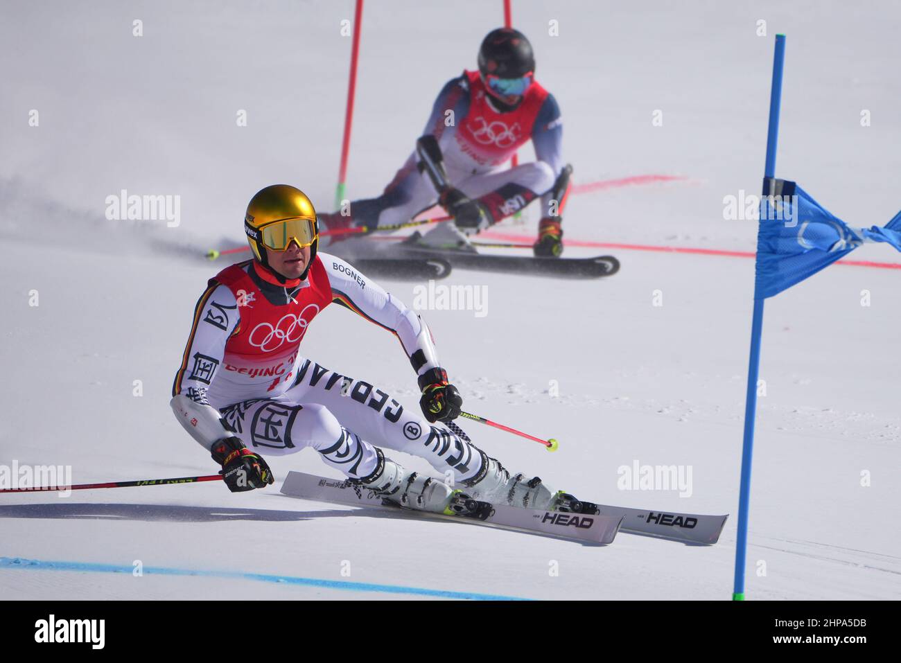 Yanqing, China. 20th Feb, 2022. Olympics, Alpine Skiing, Team, Mixed, Semifinals at the National Alpine Ski Center, Alexander Schmid of Germany and Tommy Ford (r) of the USA in action. Credit: Michael Kappeler/dpa/Alamy Live News Stock Photo