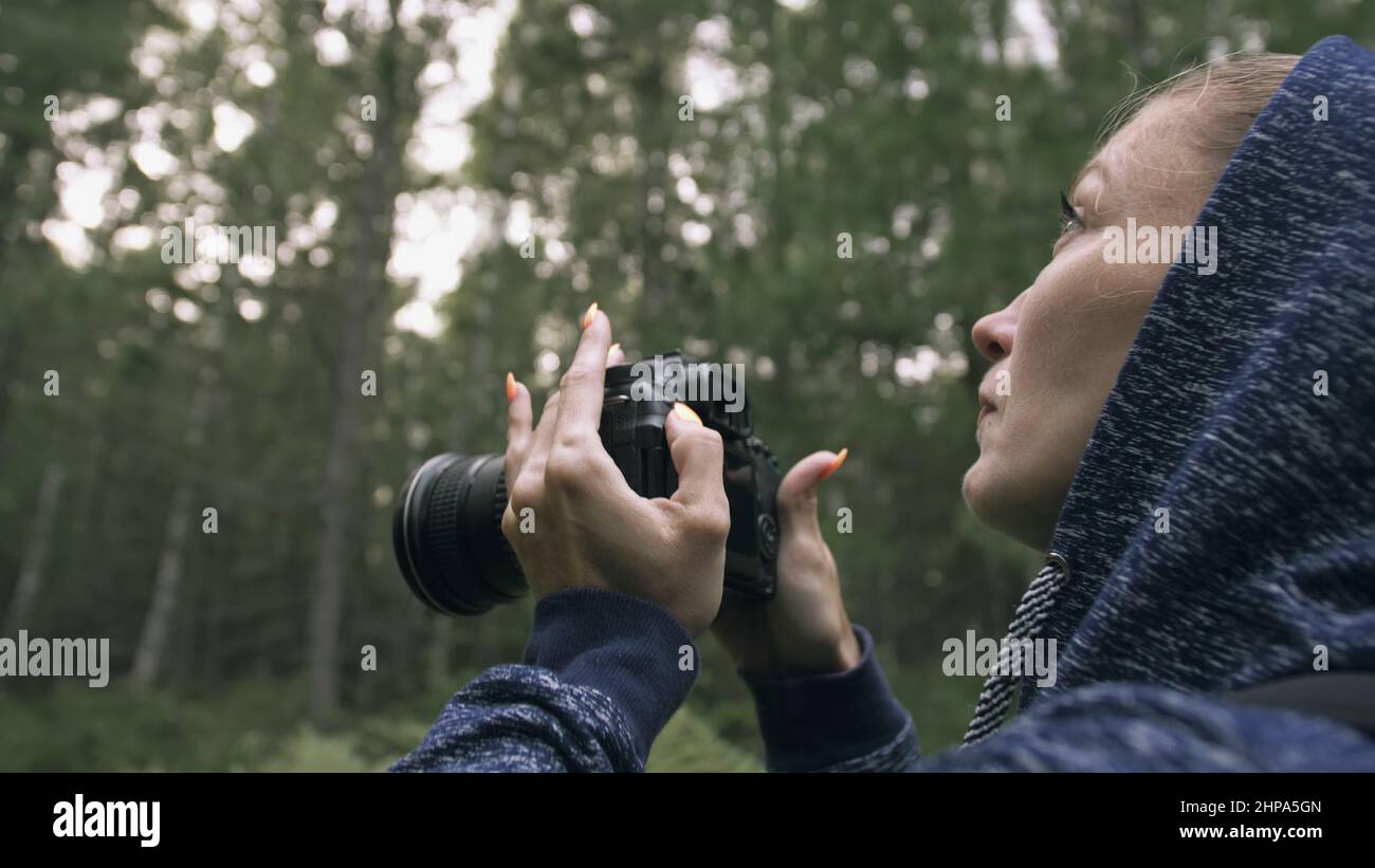 traveler-photographing-scenic-view-in-forest-one-caucasian-woman