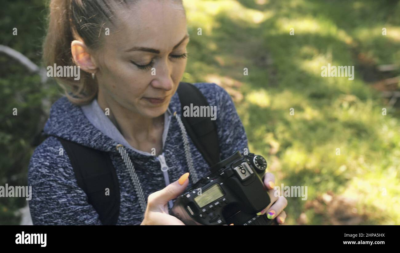 traveler-photographing-scenic-view-in-forest-one-caucasian-woman