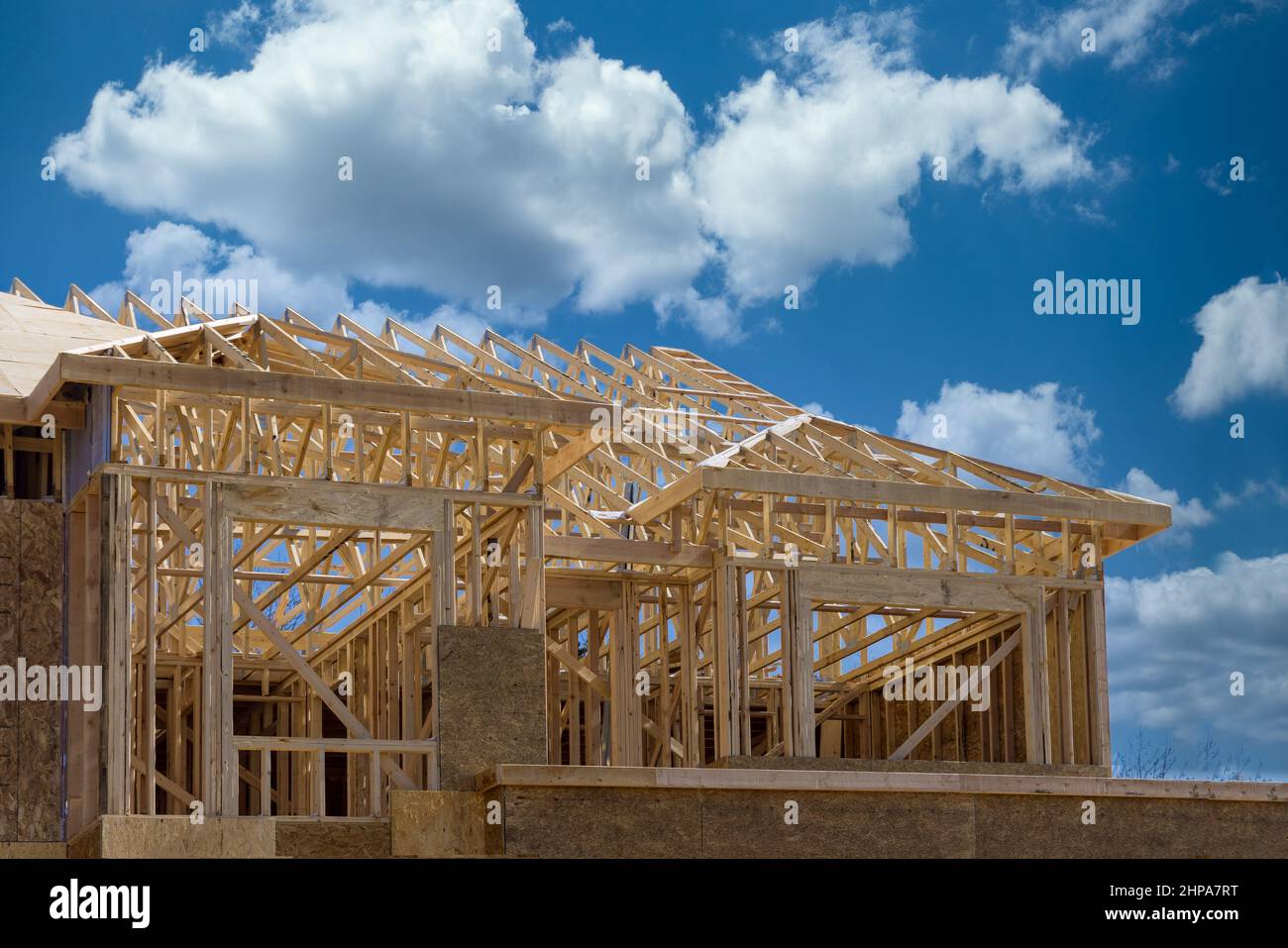 Installation of frame trusses joining with wooden beams at construction