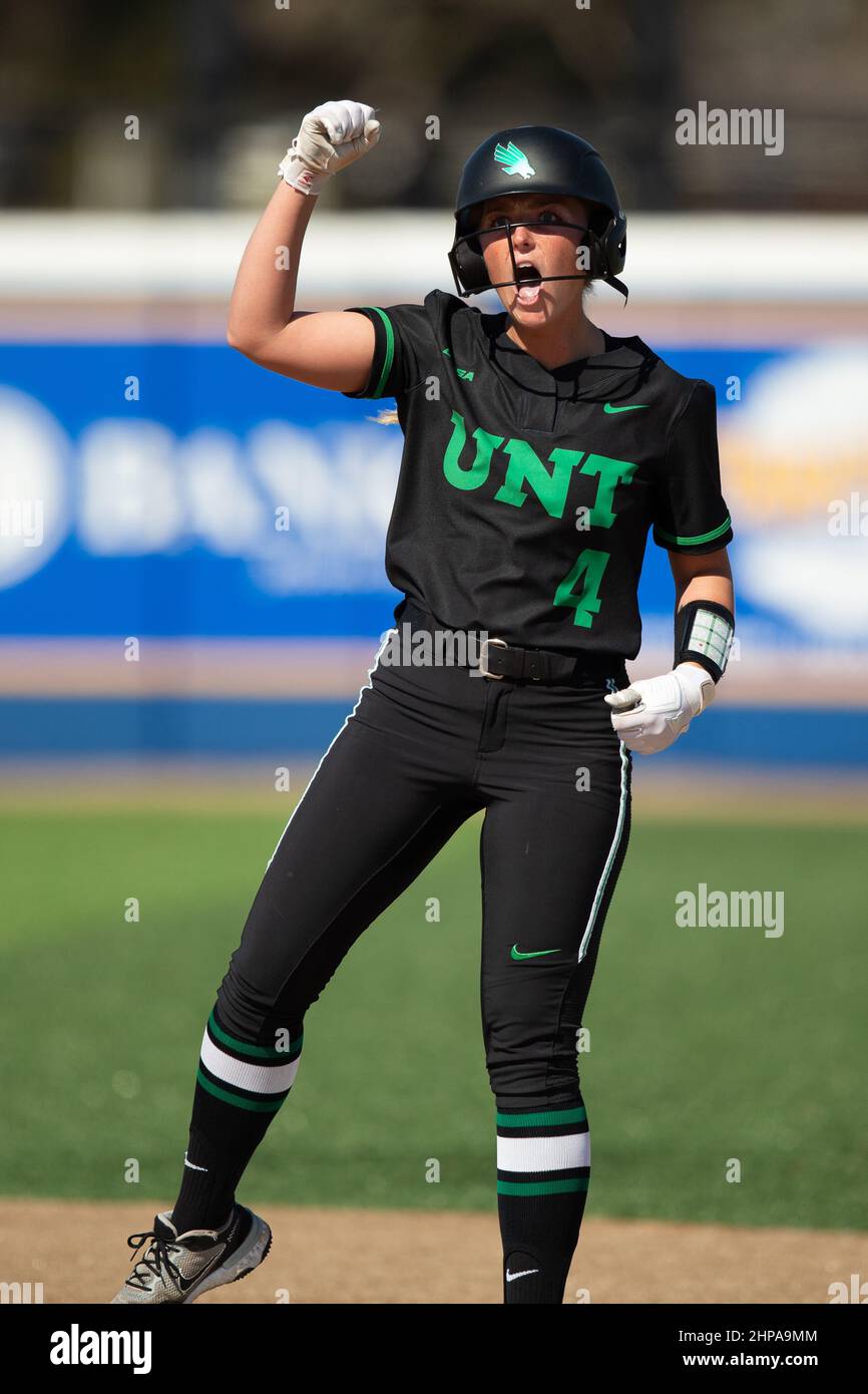 North Texas Mean Green infielder Mikayla Smith (4) celebrates hitting an RBI double against Tulsa during the McNeese State Softball Tournament, Friday Stock Photo