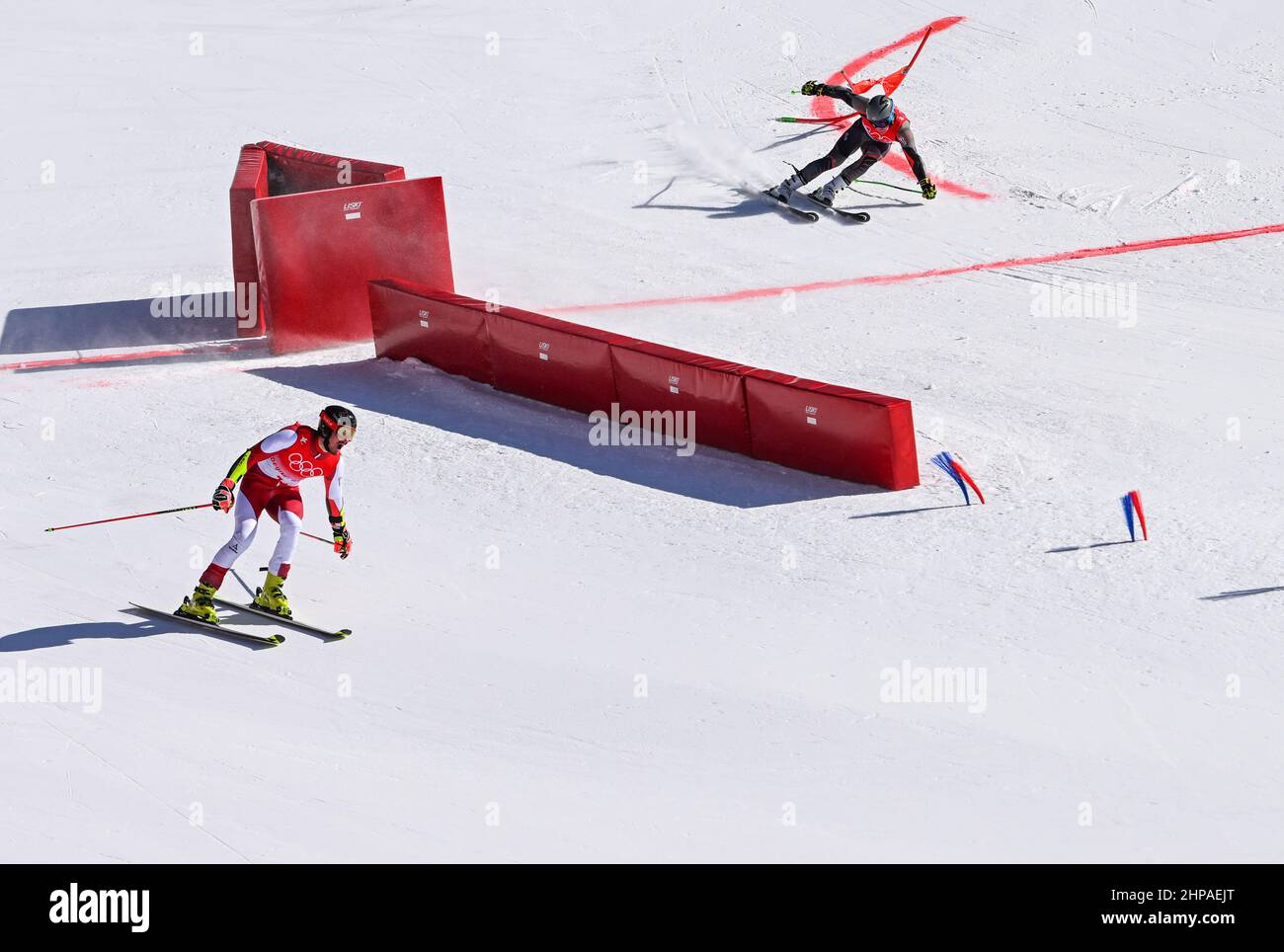 Beijing, China. 20th Feb, 2022. Stefan Brennsteiner (L) of Austria and Timon Haugan of Norway compete during the alpine skiing mixed team parallel semifinal of Beijing 2022 Winter Olympics at National Alpine Skiing Centre in Yanqing District, Beijing, capital of China, Feb. 20, 2022. Credit: Lian Zhen/Xinhua/Alamy Live News Stock Photo