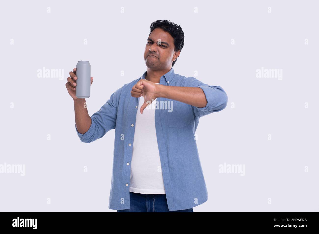 Indian Man Holding Tin Can Showing Thumb Down. Indian Man With Beer Tin