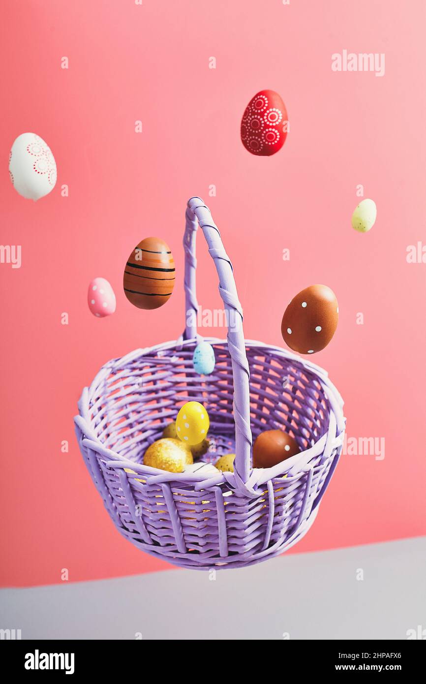 Easter eggs falling into a flying basket, Easter holiday concert Stock Photo