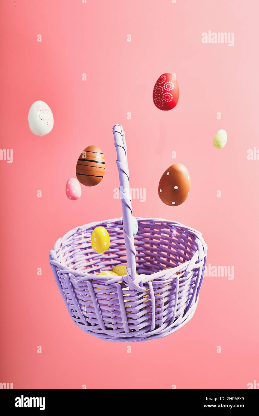 Easter eggs falling into a flying basket, Easter holiday concert Stock Photo