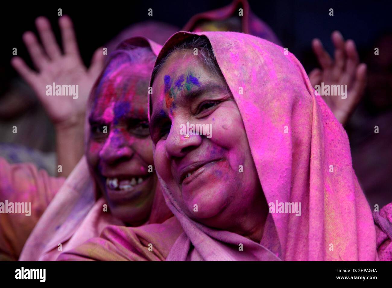 Indian widow women celebrate Holi festival in a old age home for widow women in Vrindavan, India in 2015. Stock Photo