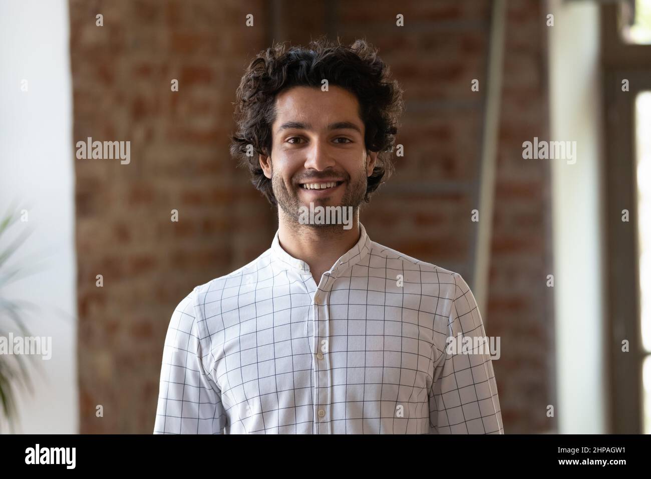 Head shot portrait of smiling handsome young man. Stock Photo