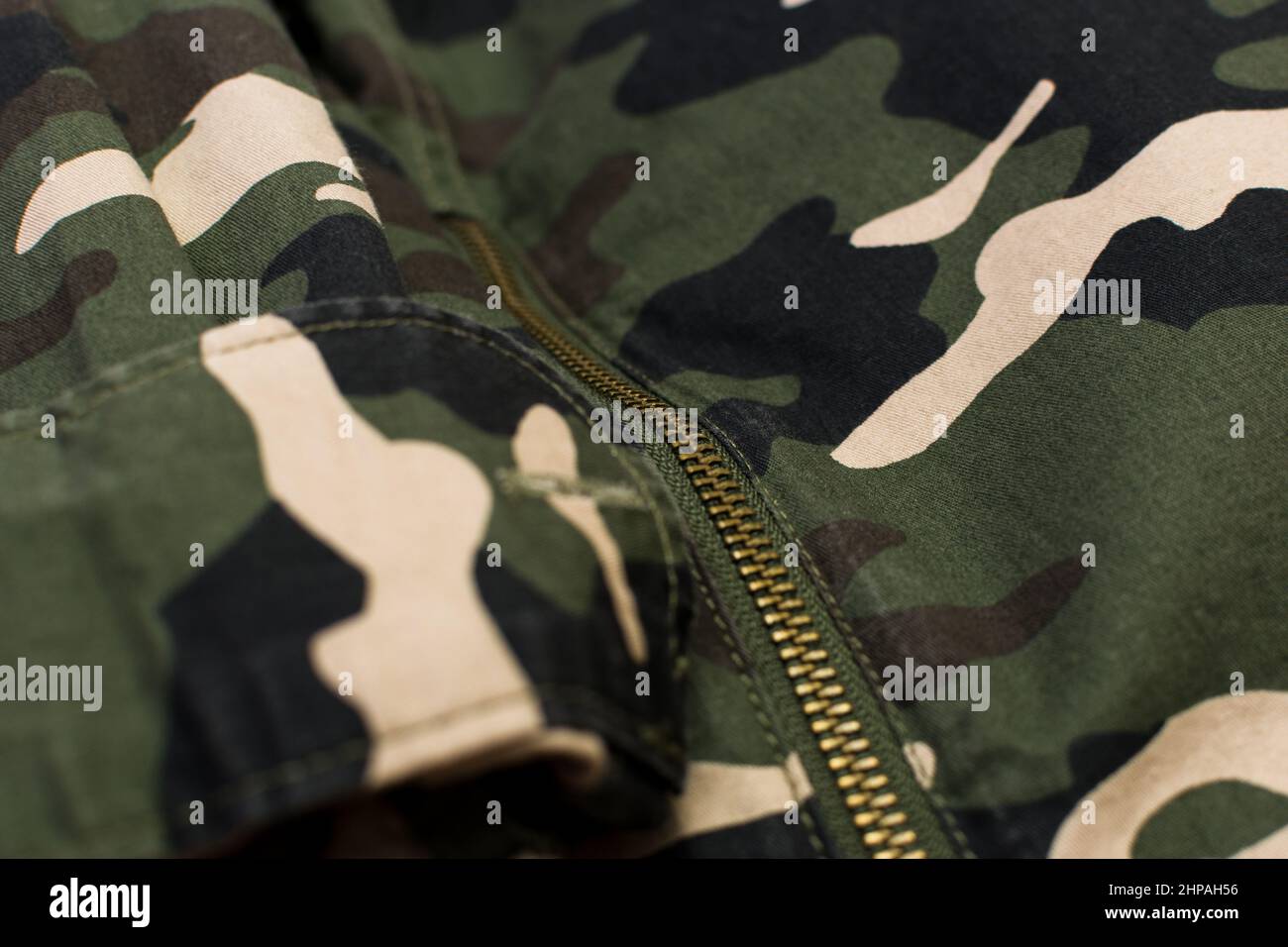 Military camouflage uniform with zipper, close up Stock Photo