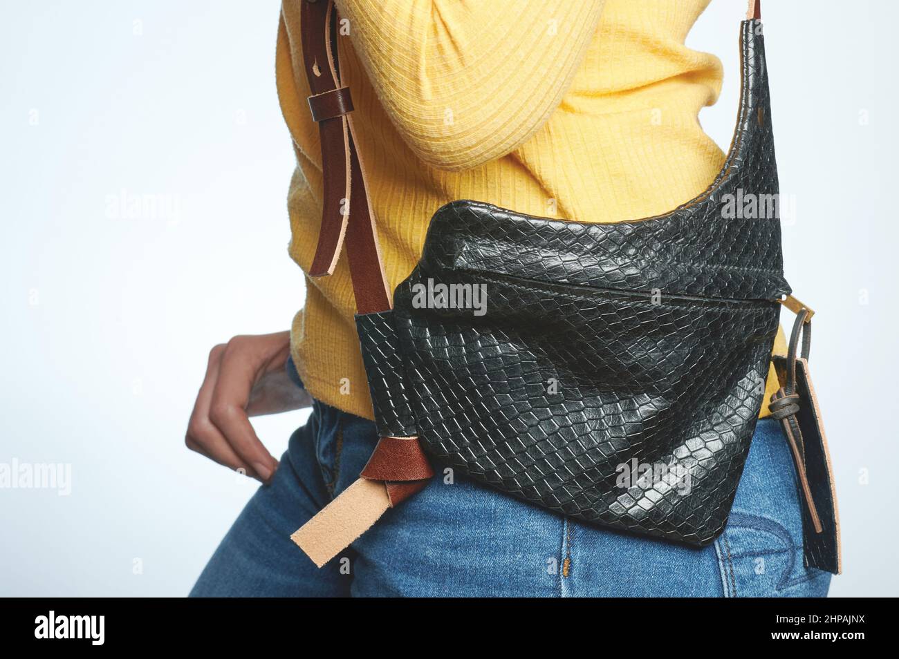 Casual stylish woman black handbag isolated on white studio background Stock Photo