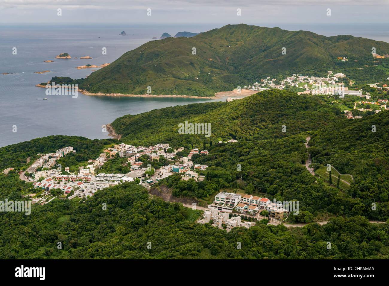 Aerial from helicopter showing houses in the Clear Water Bay peninsula, looking south to the South China Sea, Hong Kong Stock Photo