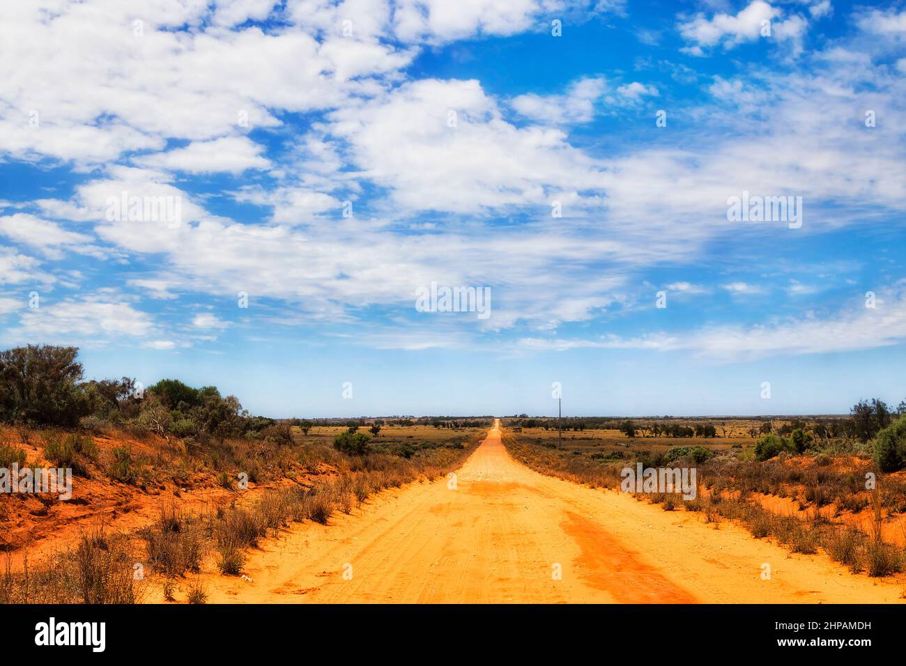 Unsealed road in Lake Mungo national park of red soil australian