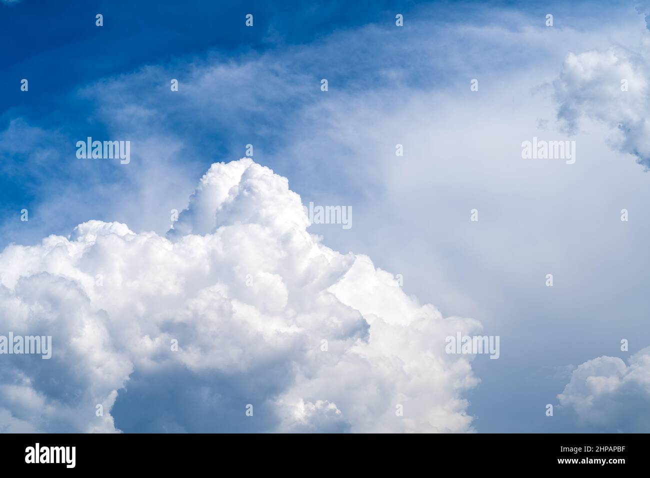 Photo of the sky with fluffy cumulus clouds Stock Photo