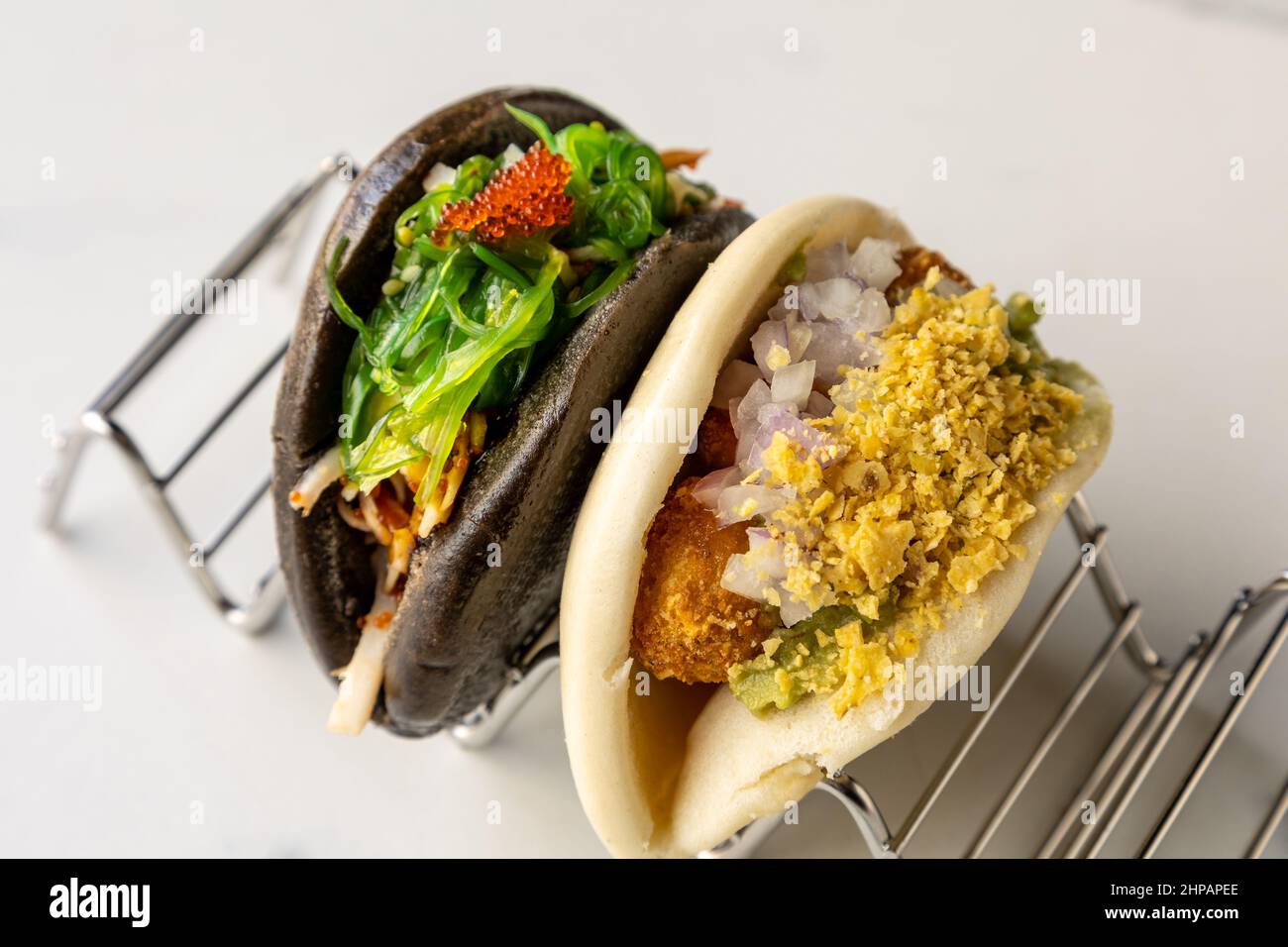 Closeup shot of two different taiwanese gua bao buns Stock Photo
